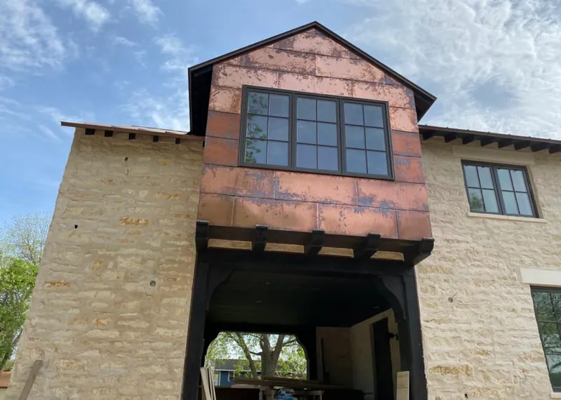 Copper metal panel facade on a stone building for Metal Roof Coating in Deer Park